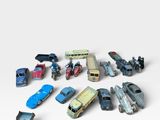 a lot of toy cars that are on a white surface