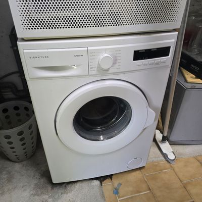 a washer and a dryer stacked on top of each other