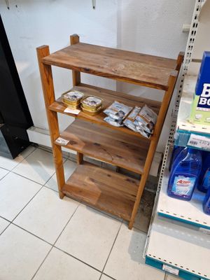 a shelf that has various items on it in a store