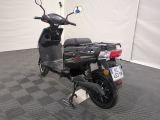 a scooter that is parked in a garage