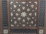 a wooden cabinet with a star design on it