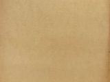 an old piece of paper with a hole in the middle of it