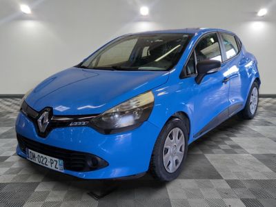 the blue car is parked on a checkered floor in a garage