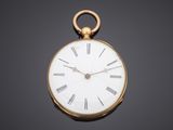 an antique gold pocket watch with roman numerals on the face