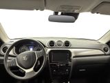 the interior of a small car with a steering wheel and dashboard