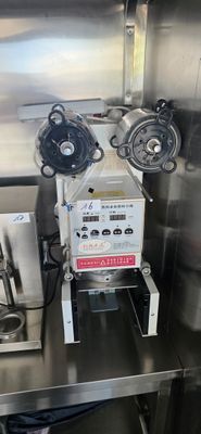 a machine that is sitting on a table in a kitchen