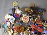 a pile of badges and other items that are on the floor