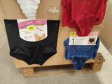 a display of underwear on a pallet in a store