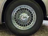 a close up of a car ' s wheel on the ground