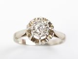 a close up of a diamond ring on a white background