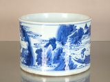 a blue and white cup sitting on a table