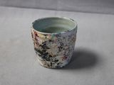 a small cup that is sitting on a table