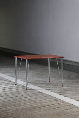 an image of a wooden table with metal legs
