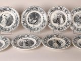 six blue and white plates with black and white designs on them