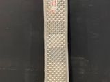 a picture of a tall metal object on a wooden floor