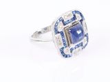an image of a blue and white diamond ring on a white background