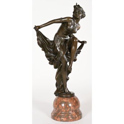 a bronze statue of a woman holding a bird on a marble base