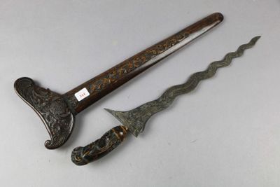 pair of antique chinese swords with carved handles and wooden handles