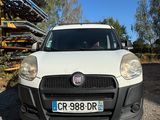 the front of a white fiat fiorin parked in a gravel lot