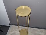 a small table with a yellow tray on top of it
