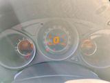 a close up of a car dashboard with various gauges