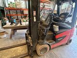 an image of a forklift truck parked in a warehouse