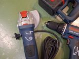 two electric tools that are sitting on a table