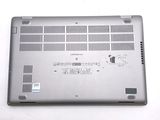 a laptop that is sitting on a white surface