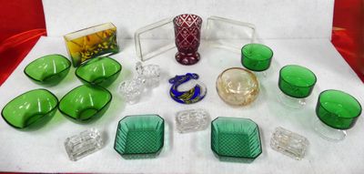 many green glass items sitting on a white table
