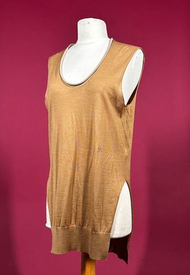 an image of a dress on a mannequin stand against a pink background
