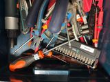 many different tools in a box with a lot of them
