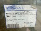 a sign on the glass of a window that says vitaglass