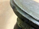 a close up of a metal object on a table