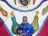 a picture of a table cloth with a variety of decorative items on it