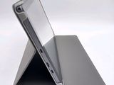 a laptop that is sitting on top of a stand