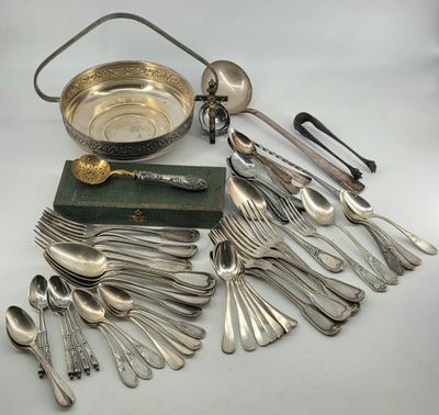 an assortment of silverware including spoons, forks, and a bowl