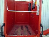 an image of a red truck with the door open
