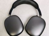 the back of a pair of black headphones on a white surface