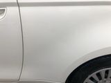 a close up of a white car with the door open