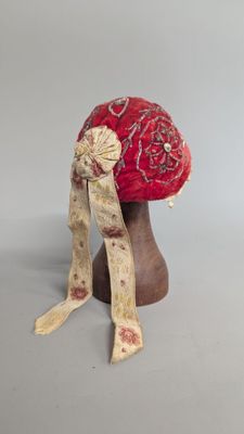 an image of a red hat with a bow on top of it
