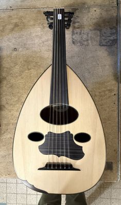 a guitar with a moustache on it and a mustache on it