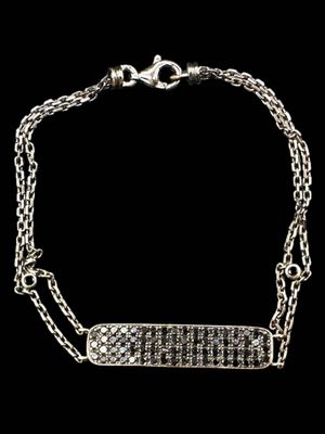 a silver chain bracelet with a bar on it