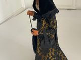 a figurine of a woman with a cane in a room