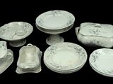 many different types of porcelain dishes and dishes on the table