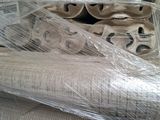 several rolls of toilet paper wrapped in plastic on a table