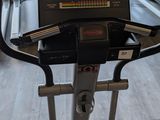 a treadmill with a laptop on top of it