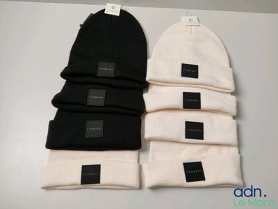 three beanies sitting on top of each other on top of a table