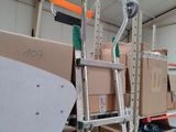 many boxes and a ladder in a warehouse
