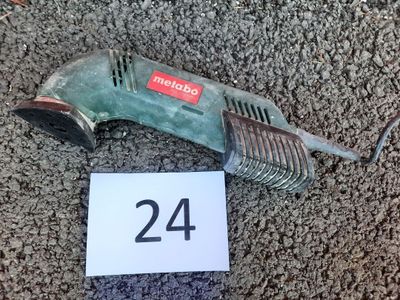 a picture of a corded drill on the ground