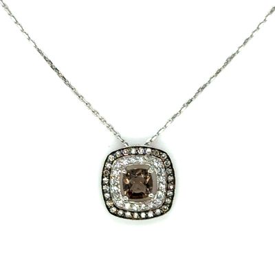 a close up of a necklace on a white background with diamonds